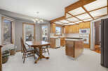 This charming kitchen boasts a warm and inviting atmosphere, perfect for family gatherings and culinary adventures.