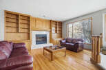 This stunning living room boasts a cozy fireplace, perfect for those chilly evenings.