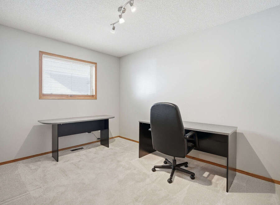 Discover the perfect home office setup in this bright and airy space.