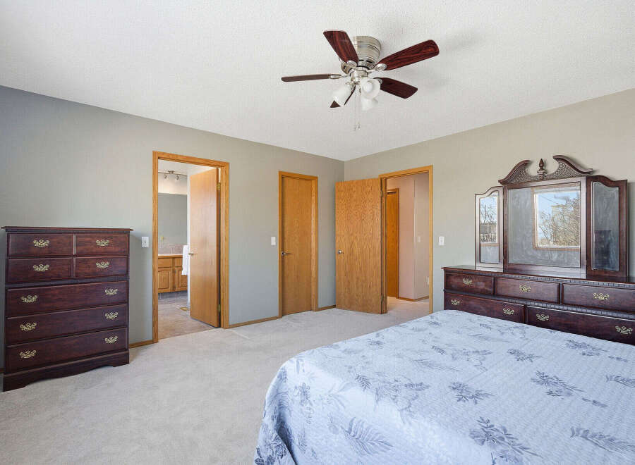 Step into this inviting bedroom, featuring a spacious layout and neutral color palette.
