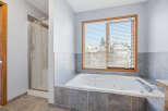 This luxurious bathroom features a relaxing jacuzzi tub, perfect for unwinding after a long day.