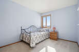 This charming bedroom features a cozy daybed, perfect for relaxing or hosting guests.