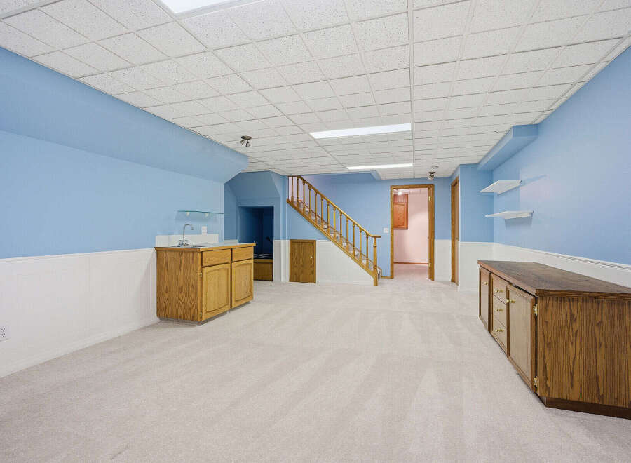 This inviting space features a well-lit interior with a neutral color palette, perfect for various design styles.