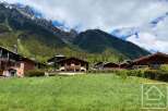 Discover your dream alpine retreat! This stunning property boasts breathtaking mountain views and charming chalet-style architecture.
