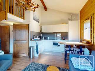 Discover the charm of this stunning property, featuring a modern kitchen with sleek white cabinetry and essential appliances.