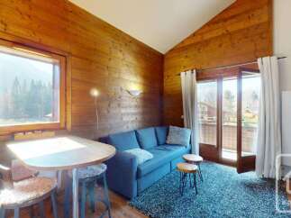 Discover the charm of this cozy cabin-style property, featuring warm wooden interiors and a welcoming atmosphere.