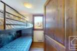 Discover this charming property featuring a cozy bunk bed setup, perfect for accommodating guests or family.