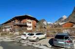 Discover a charming property nestled in a picturesque mountain setting.