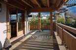 Enjoy breathtaking mountain views from this stunning wooden deck.