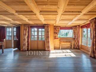 Step into a world of rustic elegance with this stunning property, showcasing exquisite wooden architecture.