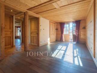 Step into a world of rustic charm with this stunning property, featuring exquisite wooden interiors and a warm, inviting ambiance.
