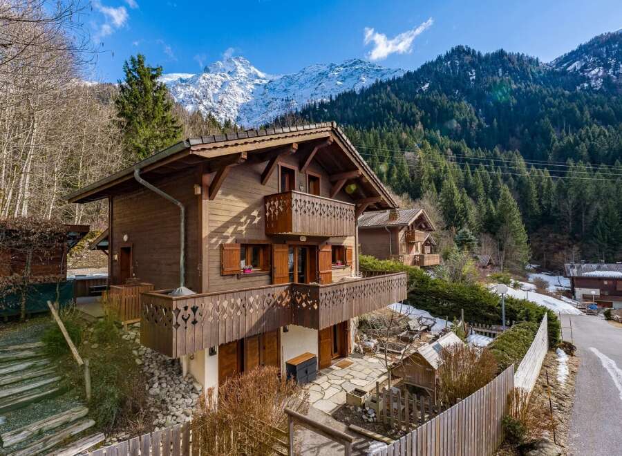Nestled in a picturesque mountain setting, this charming wooden chalet offers a tranquil retreat.