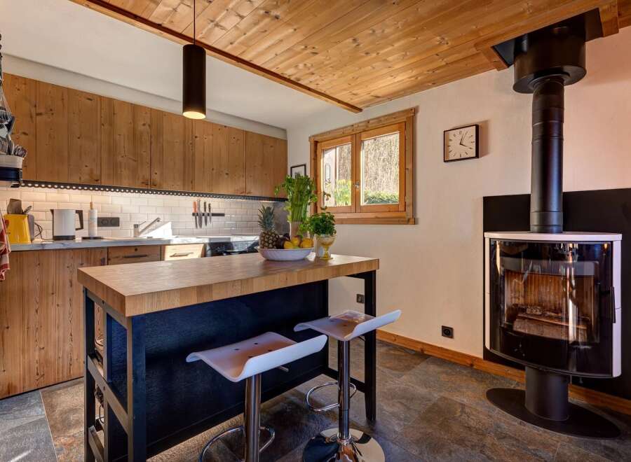 This stunning kitchen boasts a warm and inviting atmosphere, perfect for culinary creations and entertaining.