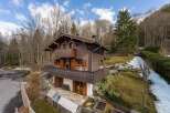 Nestled in a serene natural setting, this charming wooden chalet offers a perfect blend of rustic elegance and modern comfort.