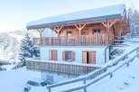 Discover the charm of this stunning chalet nestled in a winter wonderland.