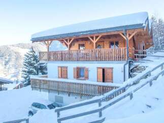 Discover the charm of this stunning chalet nestled in a winter wonderland.