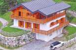 This stunning chalet-style home offers a perfect blend of rustic charm and modern comfort.