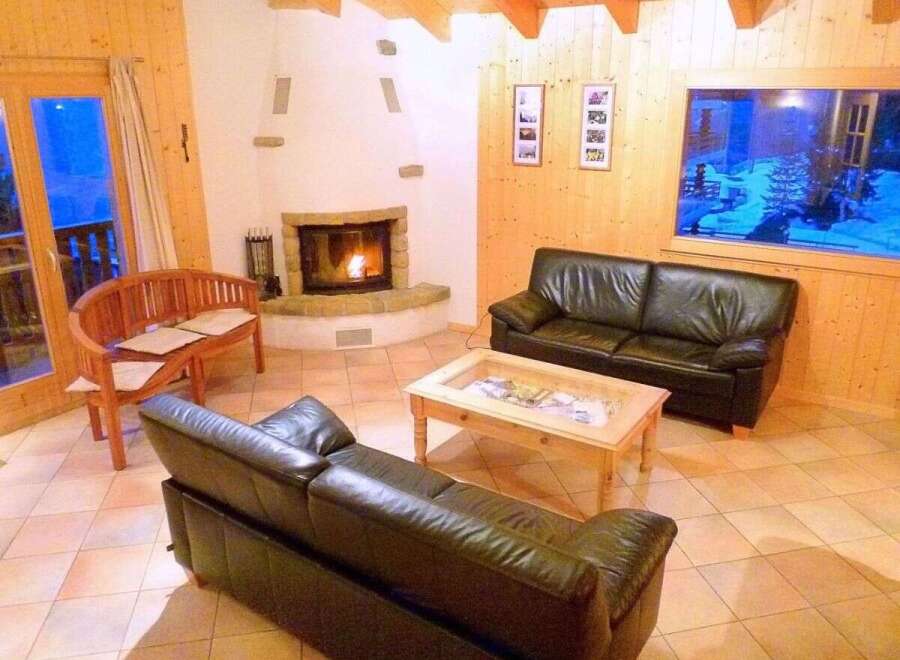 Cozy living room with a fireplace and comfortable seating.