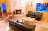 Cozy living room with a fireplace and comfortable seating.