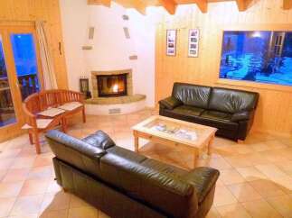 Cozy living room with a fireplace and comfortable seating.
