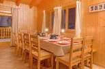 This charming dining area features a warm, inviting atmosphere, perfect for family gatherings or intimate dinners.