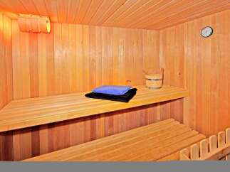 Step into relaxation with this inviting sauna.