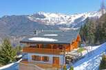 Discover your dream mountain retreat! This stunning property boasts a charming wooden exterior and a cozy interior, perfect for a relaxing getaway.