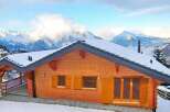 Discover the charm of this stunning wooden chalet nestled in a picturesque mountain setting.
