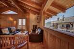 Experience rustic charm and breathtaking mountain views from this cozy living room.