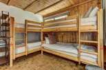 This cozy bunk room offers a unique and inviting space for guests.
