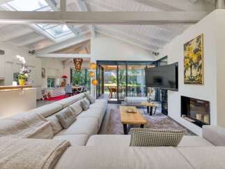 Experience luxury living in this stunning property, featuring a spacious open-plan design with high ceilings and abundant natural light.
