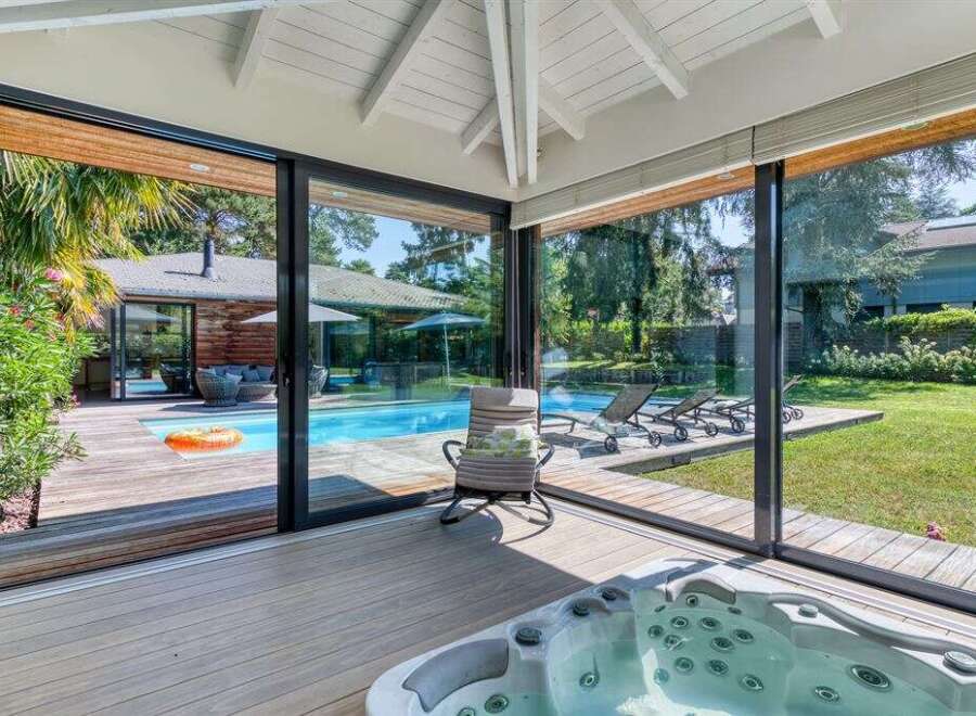 Experience luxury living with this stunning property featuring a private pool and a relaxing hot tub.
