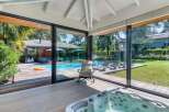 Experience luxury living with this stunning property featuring a private pool and a relaxing hot tub.