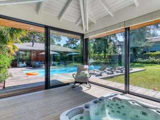 Experience luxury living with this stunning property featuring a private pool and a relaxing hot tub.