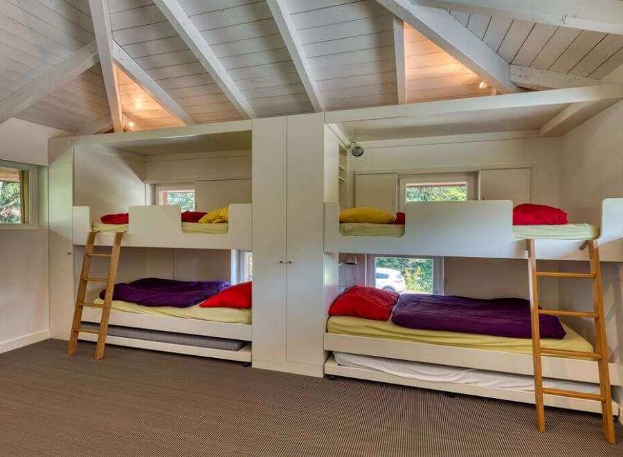 This stunning property features a unique bunk bed setup, perfect for a family or group.