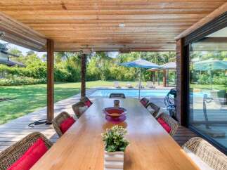 Experience luxury living with this stunning outdoor dining area.