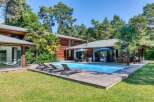 Discover your dream home in this stunning property featuring a private pool and expansive wooden deck, perfect for relaxation and entertaining.