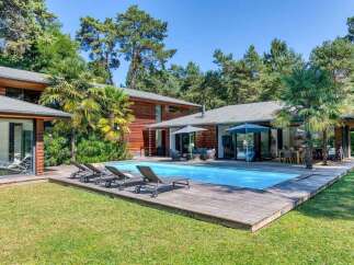 Discover your dream home in this stunning property featuring a private pool and expansive wooden deck, perfect for relaxation and entertaining.