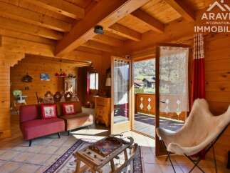Discover the charm of this stunning property, featuring a cozy interior with wooden accents and a warm, inviting atmosphere.