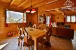 Step into this charming chalet, boasting a warm and inviting interior with wooden walls and ceilings.