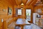 This charming property features a cozy wooden interior, creating a warm and inviting atmosphere.