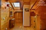 Discover the charm of this stunning property, featuring exquisite wooden paneling and a warm, inviting ambiance.