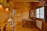 Discover the charm of this cozy wooden interior, perfect for a mountain retreat.