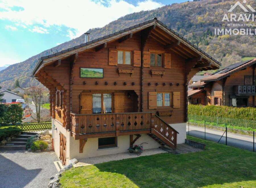 Discover the charm of this stunning wooden chalet nestled in a picturesque mountain setting.