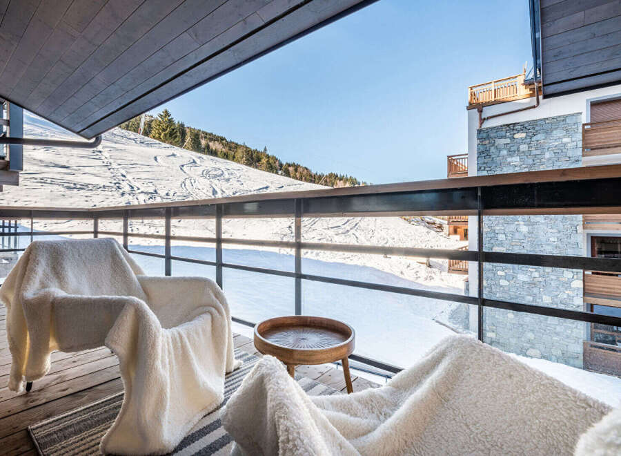 Enjoy breathtaking mountain views from this luxurious balcony.