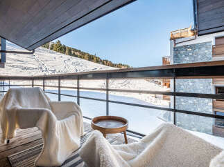 Enjoy breathtaking mountain views from this luxurious balcony.