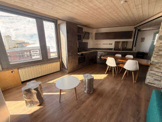 Experience the charm of this modern apartment, featuring a well-equipped kitchen and a cozy dining area perfect for gatherings.