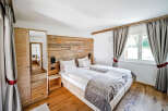 Experience rustic elegance in this stunning bedroom.