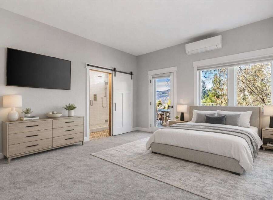 Step into luxury with this stunning bedroom featuring a modern design and ample natural light.
