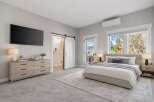 Step into luxury with this stunning bedroom featuring a modern design and ample natural light.